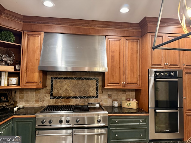 124 N Valhalla Ln, Cordele, GA 31015 - kitchen with stainless steel appliances, ventilation hood, dark countertops, and tasteful backsplash