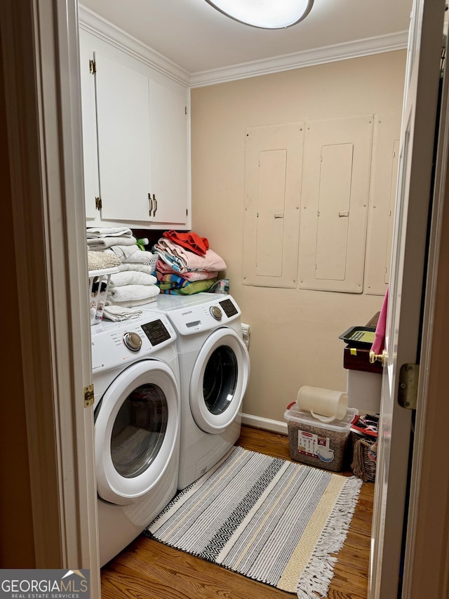 124 N Valhalla Ln, Cordele, GA 31015 - washroom featuring cabinet space, wood finished floors, washing machine and dryer, and crown molding