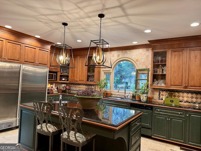 124 N Valhalla Ln, Cordele, GA 31015 - kitchen with stainless steel appliances, a sink, tasteful backsplash, brown cabinets, and crown molding