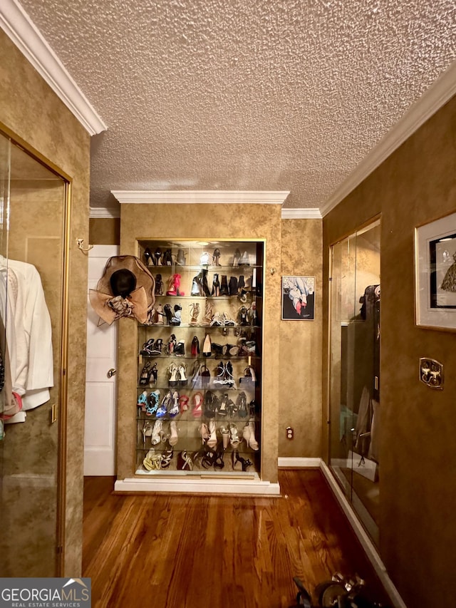 124 N Valhalla Ln, Cordele, GA 31015 - wine room with wood finished floors, a textured ceiling, and crown molding