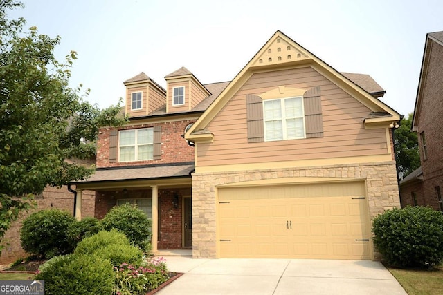 560 Tuscany Walk Ln, Lawrenceville, GA 30043 - view of front of property with an attached garage, driveway, brick siding, and stone siding