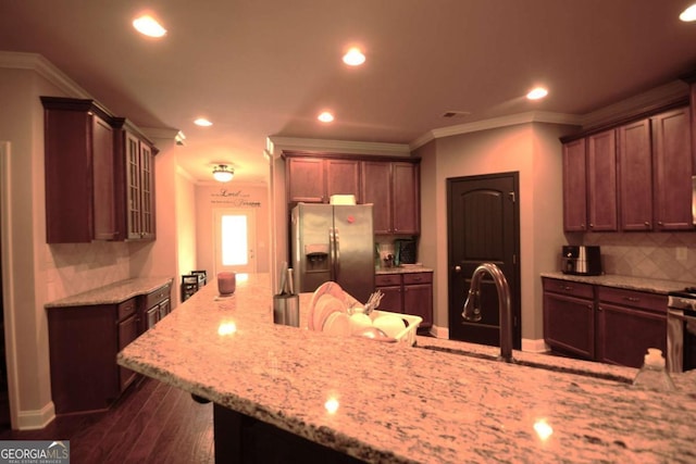 560 Tuscany Walk Ln, Lawrenceville, GA 30043 - kitchen featuring stainless steel fridge with ice dispenser, tasteful backsplash, light stone counters, recessed lighting, and glass insert cabinets
