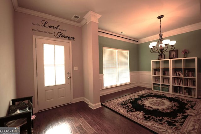 560 Tuscany Walk Ln, Lawrenceville, GA 30043 - foyer entrance featuring a chandelier, crown molding, dark wood-style floors, and a wainscoted wall