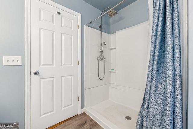 5102 Yellow Stone Dr, Flowery Branch, GA 30542 - bathroom featuring a shower with curtain and wood finished floors