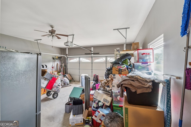 5102 Yellow Stone Dr, Flowery Branch, GA 30542 - garage with freestanding refrigerator, a garage door opener, and a ceiling fan