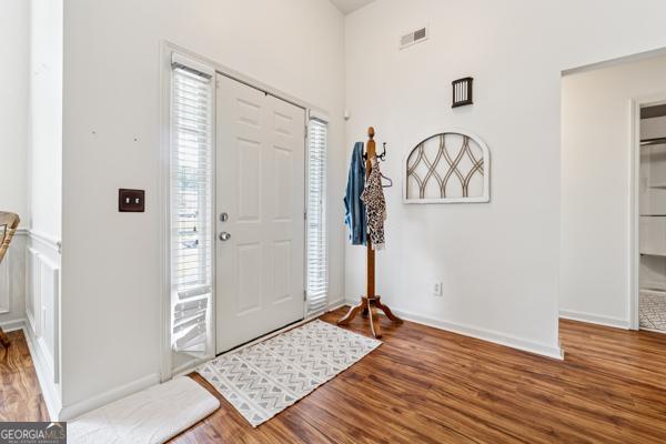 5102 Yellow Stone Dr, Flowery Branch, GA 30542 - entrance foyer featuring wood finished floors and baseboards