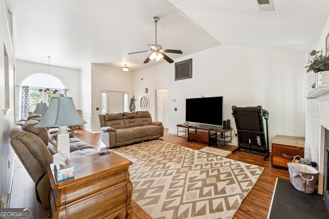 5102 Yellow Stone Dr, Flowery Branch, GA 30542 - living room with wood finished floors, a ceiling fan, lofted ceiling, and a fireplace with raised hearth