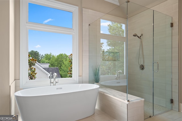 4530 Westgate Dr, Cumming, GA 30040 - full bathroom with a freestanding tub, a shower stall, and tile patterned flooring