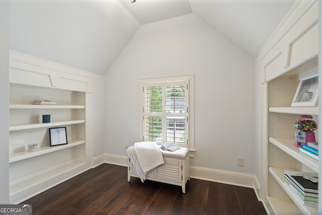 4530 Westgate Dr, Cumming, GA 30040 - living area with dark wood-style floors, vaulted ceiling, and built in shelves