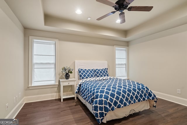 4530 Westgate Dr, Cumming, GA 30040 - bedroom with a tray ceiling, dark wood-type flooring, ceiling fan, and recessed lighting