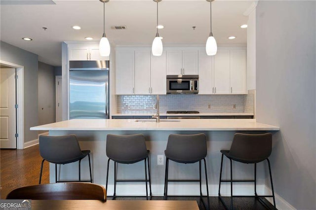 270 17th St NW Unit 2210, Atlanta, GA 30363 - kitchen featuring appliances with stainless steel finishes, white cabinets, backsplash, and recessed lighting