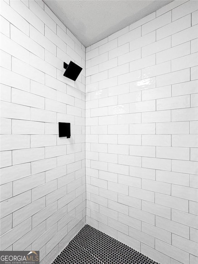 9404 Cypress Ln, Jonesboro, GA 30238 - full bath featuring tiled shower and a textured ceiling