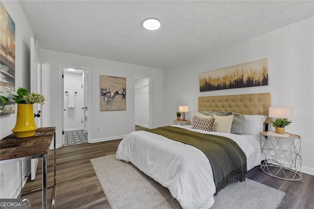 9404 Cypress Ln, Jonesboro, GA 30238 - bedroom featuring wood finished floors, baseboards, and a spacious closet