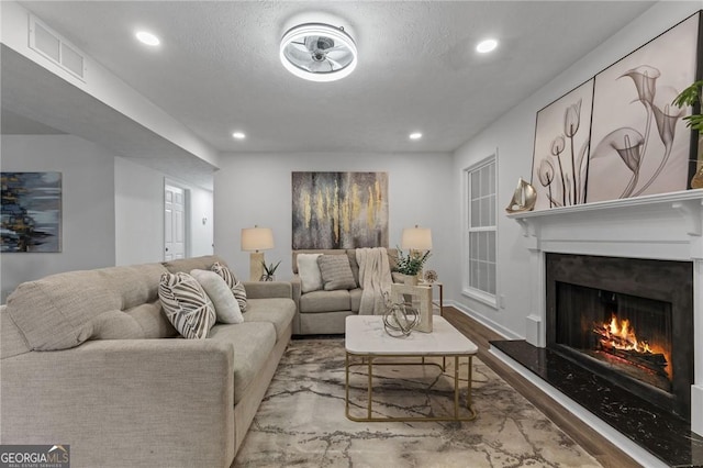 9404 Cypress Ln, Jonesboro, GA 30238 - living room with wood finished floors, recessed lighting, and a fireplace