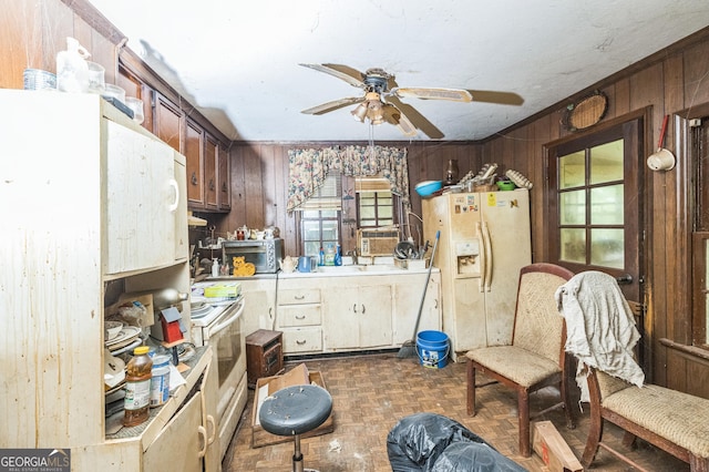 205 Elm St, Washington, GA 30673 - kitchen with white appliances, a ceiling fan, wood walls, and light countertops