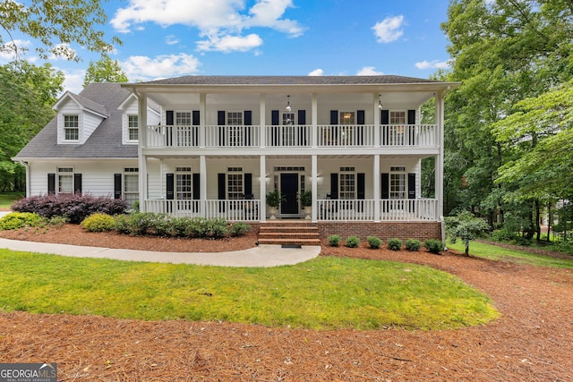 607 Lees Mill Rd, Fayetteville, GA 30214 - view of front of property featuring a balcony, a porch, a front lawn, and roof with shingles