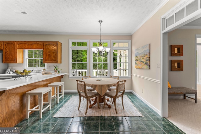 607 Lees Mill Rd, Fayetteville, GA 30214 - dining room featuring a chandelier, crown molding, baseboards, dark tile patterned flooring, and a textured ceiling
