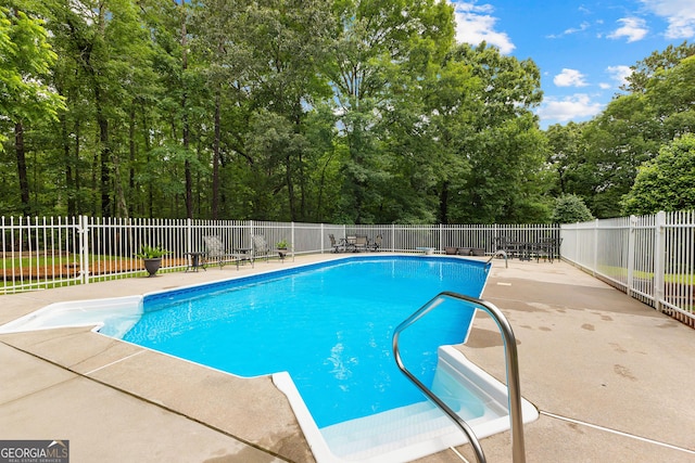 607 Lees Mill Rd, Fayetteville, GA 30214 - view of swimming pool with a patio area and view of scattered trees