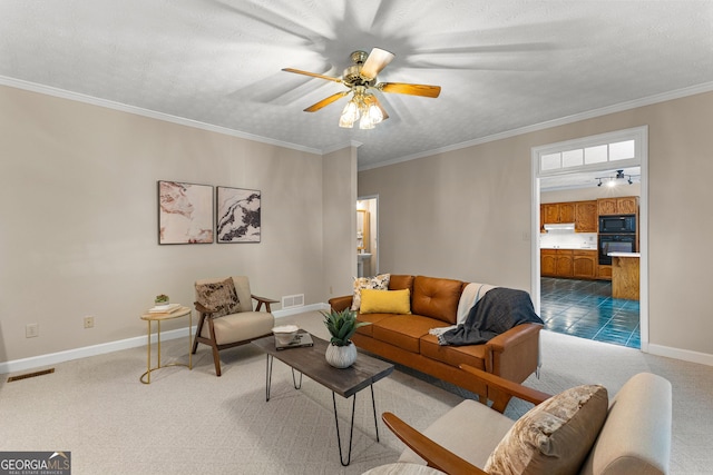 607 Lees Mill Rd, Fayetteville, GA 30214 - carpeted living room with ceiling fan, baseboards, and ornamental molding
