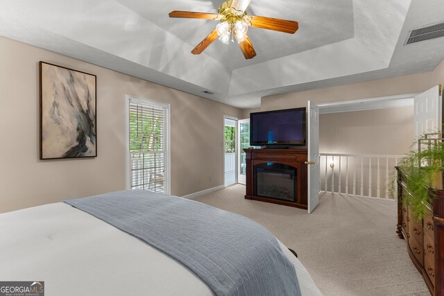 607 Lees Mill Rd, Fayetteville, GA 30214 - bedroom with a raised ceiling, carpet flooring, and a ceiling fan