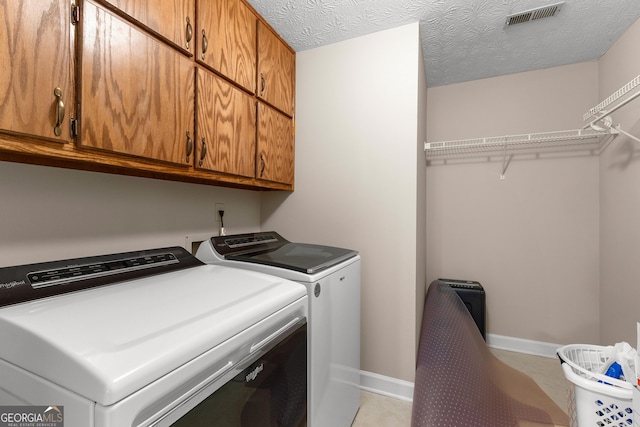 607 Lees Mill Rd, Fayetteville, GA 30214 - laundry room with cabinet space, washing machine and clothes dryer, and baseboards