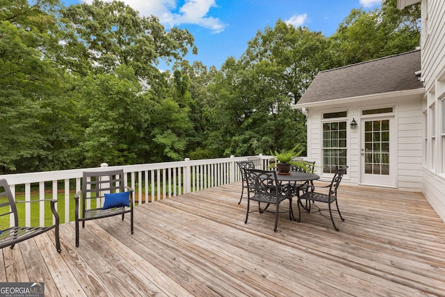 607 Lees Mill Rd, Fayetteville, GA 30214 - wooden deck featuring outdoor dining area and view of wooded area