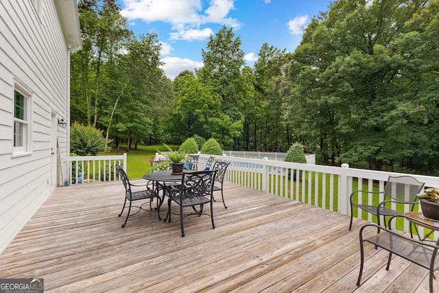 607 Lees Mill Rd, Fayetteville, GA 30214 - wooden deck featuring outdoor dining space and view of wooded area