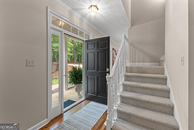 607 Lees Mill Rd, Fayetteville, GA 30214 - foyer featuring stairway, wood finished floors, crown molding, and baseboards