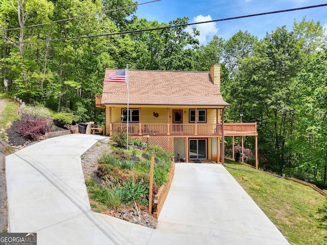 224 Shake Rag Rd, Hiawassee, GA 30546 - view of front of property featuring driveway, a chimney, roof with shingles, and a front lawn