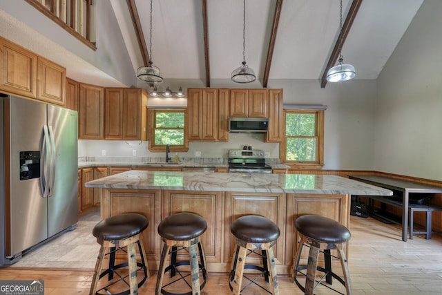 224 Shake Rag Rd, Hiawassee, GA 30546 - kitchen featuring appliances with stainless steel finishes, beam ceiling, a center island, light stone counters, and hanging light fixtures