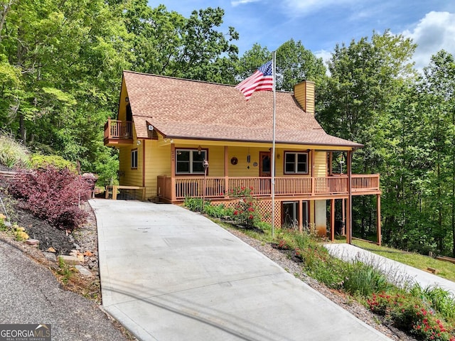 224 Shake Rag Rd, Hiawassee, GA 30546 - view of front of property featuring a chimney, concrete driveway, a porch, and roof with shingles