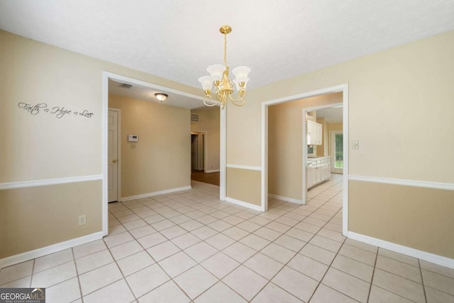467 Ravinia Way, Lawrenceville, GA 30044 - spare room featuring a chandelier, baseboards, and light tile patterned floors