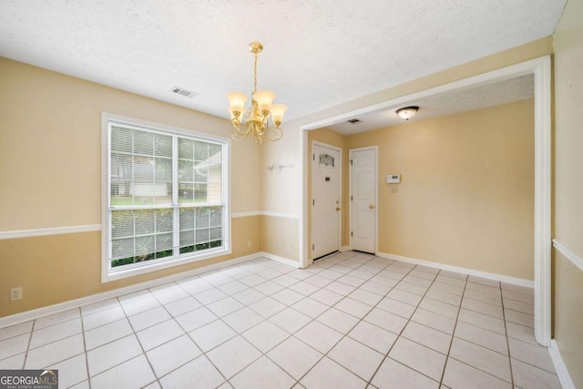 467 Ravinia Way, Lawrenceville, GA 30044 - unfurnished room featuring a chandelier, a textured ceiling, baseboards, and light tile patterned flooring