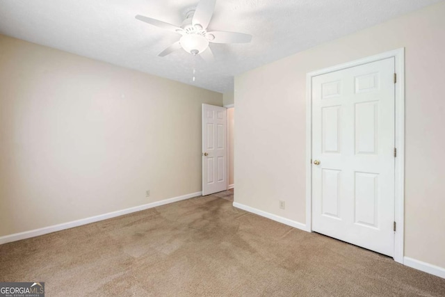 467 Ravinia Way, Lawrenceville, GA 30044 - unfurnished bedroom with carpet, baseboards, and a ceiling fan