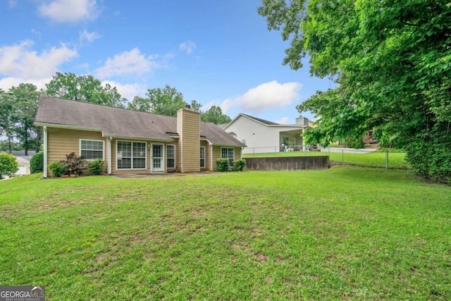 467 Ravinia Way, Lawrenceville, GA 30044 - back of property with a chimney