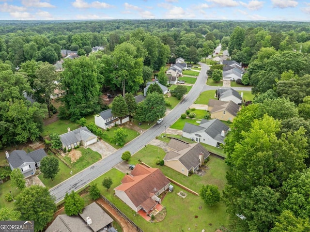 467 Ravinia Way, Lawrenceville, GA 30044 - aerial overview of property's location featuring nearby suburban area and a heavily wooded area