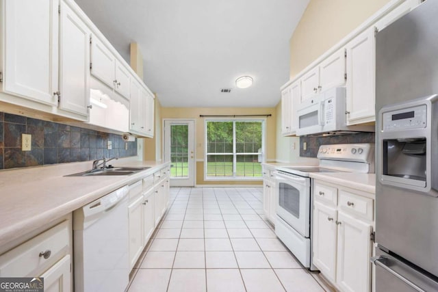 467 Ravinia Way, Lawrenceville, GA 30044 - kitchen with white appliances, a sink, light countertops, decorative backsplash, and white cabinets