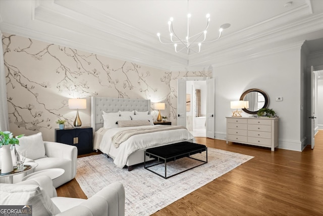3057 Watsons Bnd, Milton, GA 30004 - bedroom featuring a raised ceiling, a chandelier, wood finished floors, crown molding, and wallpapered walls