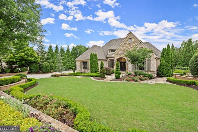 3057 Watsons Bnd, Milton, GA 30004 - view of front of house featuring stone siding and a front yard