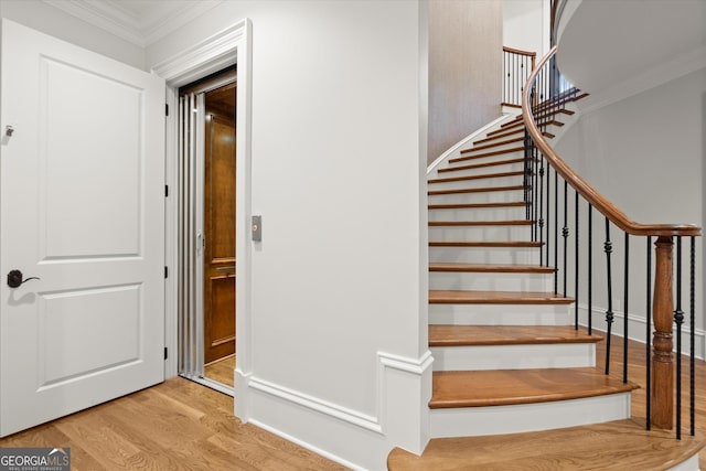 3057 Watsons Bnd, Milton, GA 30004 - staircase with wood finished floors and ornamental molding