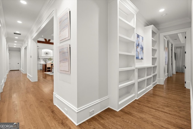 3057 Watsons Bnd, Milton, GA 30004 - corridor featuring ornamental molding, wood finished floors, recessed lighting, and built in shelves