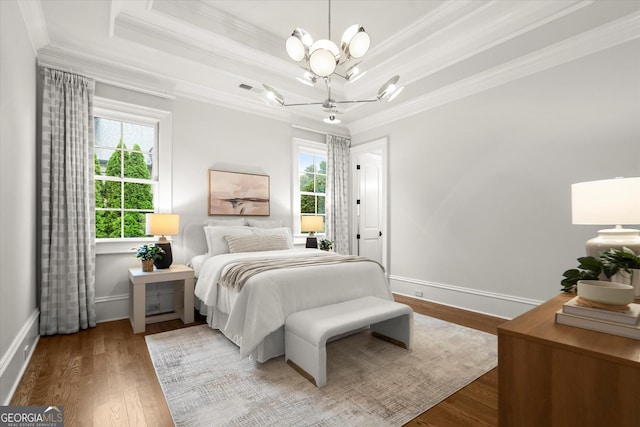 3057 Watsons Bnd, Milton, GA 30004 - bedroom featuring crown molding, a chandelier, a tray ceiling, and wood finished floors