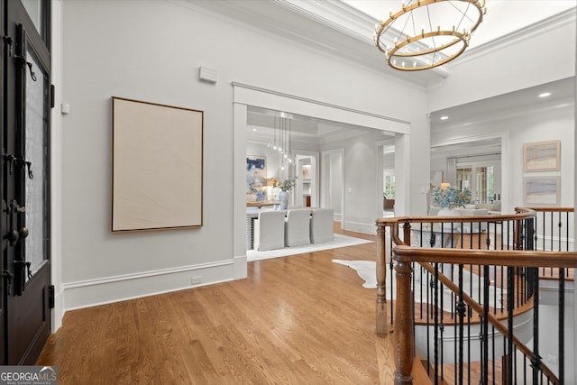 3057 Watsons Bnd, Milton, GA 30004 - foyer with a chandelier, crown molding, and light wood-type flooring