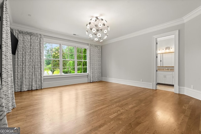 3057 Watsons Bnd, Milton, GA 30004 - unfurnished living room featuring crown molding, a chandelier, and wood finished floors