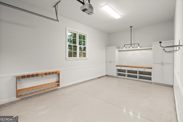 3057 Watsons Bnd, Milton, GA 30004 - garage with a garage door opener and wainscoting