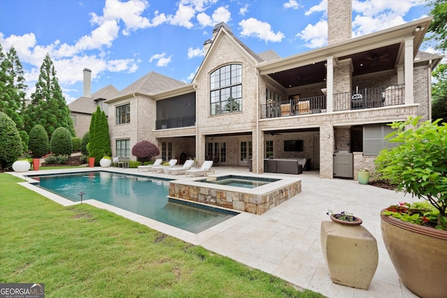 3057 Watsons Bnd, Milton, GA 30004 - back of property featuring a balcony, a patio area, ceiling fan, and an in-ground hot tub