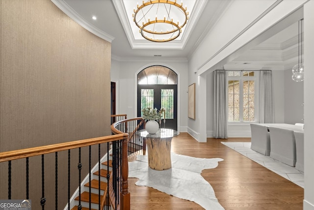 3057 Watsons Bnd, Milton, GA 30004 - entrance foyer featuring a tray ceiling, a chandelier, crown molding, and wood finished floors
