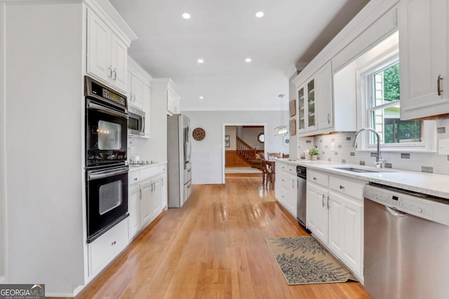 2535 Winthrope Way, Lawrenceville, GA 30044 - kitchen with black appliances, a sink, white cabinets, and recessed lighting