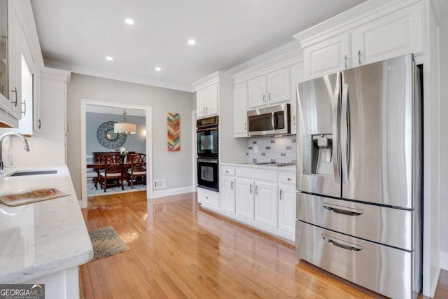 2535 Winthrope Way, Lawrenceville, GA 30044 - kitchen featuring black appliances, a sink, white cabinetry, decorative backsplash, and recessed lighting