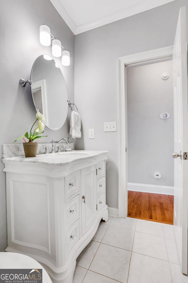 2535 Winthrope Way, Lawrenceville, GA 30044 - bathroom with vanity, tile patterned floors, crown molding, and baseboards
